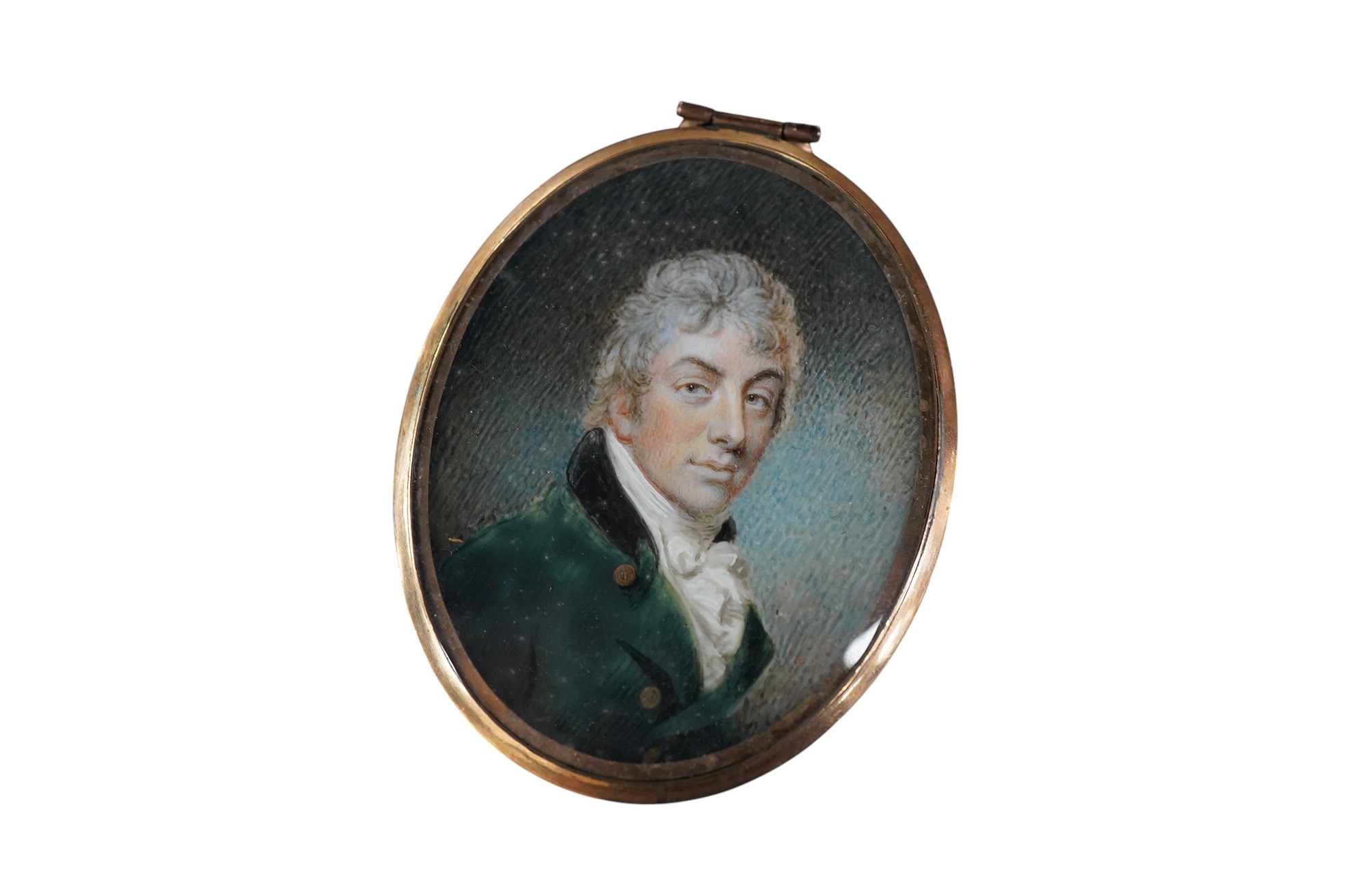 Regency School, Portrait miniature of a gentleman wearing a frock coat and cravat, oval watercolour on ivory, with hair-work panel verso, 6 x 4cm, housed in a gilt metal pendant frame CITES Submission reference 75C3EP3V
